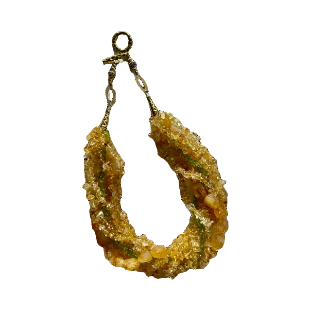 A 7-strand necklace with gold embellishments, featuring radiant citrine and faceted citrine beads along with vibrant peridot beads.