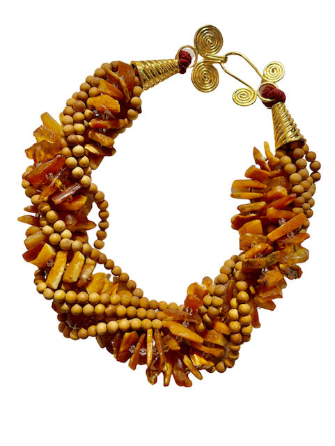 An 18-inch amber and sandalwood necklace with gold-plated embellishments.