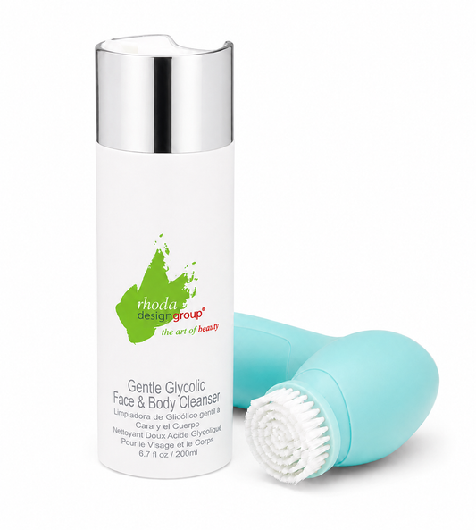Rhoda Design Group Gentle Glycolic Face & Body Cleanser shown with its white cylindrical bottle featuring a silver cap and a mint green handheld cleansing device with a white bristle head, on a white background.